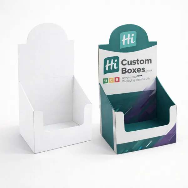 Two cardboard counter display units- one blank white and one with vibrant teal and purple graphics- class=